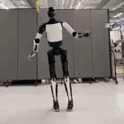 Black and White Robot in Front of Number 6