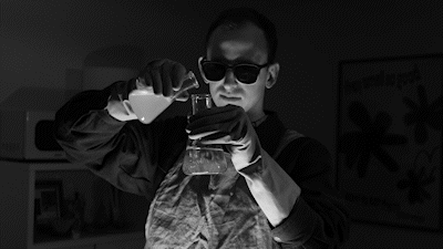 Black And White Scientist Mixing Chemicals GIF