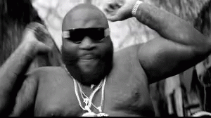 Black And White Shirtless Man With Sunglasses And Chain GIF