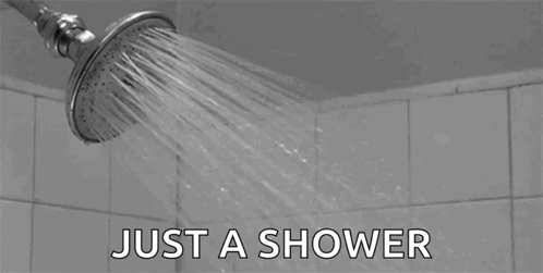 Black and White Shower Head Spraying Water