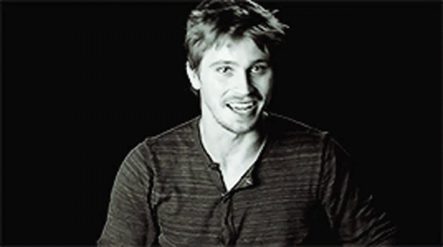 Black and White Smiling Man in Striped Shirt
