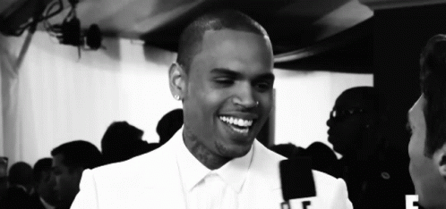 Black And White Smiling Man With F On Shirt GIF