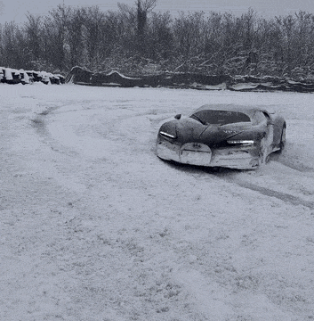 Black and White Snow Photo of Car With Bugatti on Front