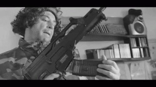 Black And White Soldier Loading Gun GIF