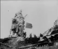 Black and White Statue on Building