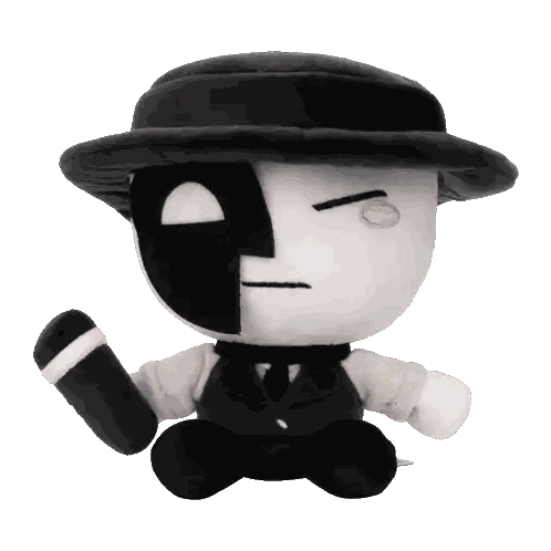 Black and White Stuffed Toy with Hat