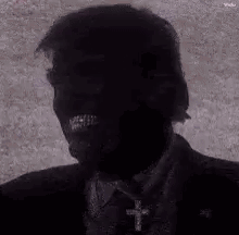 Black and White Suited Man With Cross Necklace