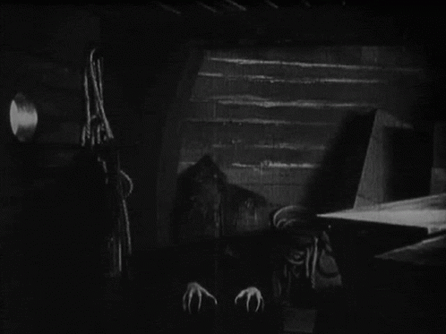 Black And White Vampire With Long Claws GIF