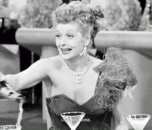 Black And White Woman At Table With Martini Glass GIF