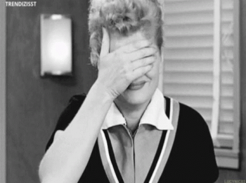 Black and White Woman Covering Face with Hand