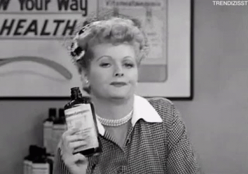 Black and White Woman Holding Bottle