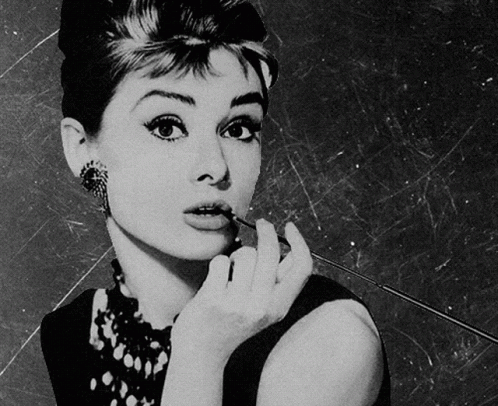 Black and White Woman Holding Cigarette