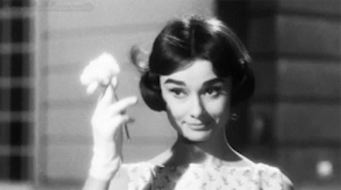 Black and White Woman Holding Flower