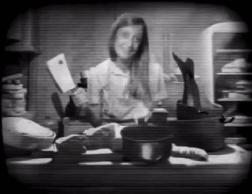 Black and White Woman Holding Knife and Bottle
