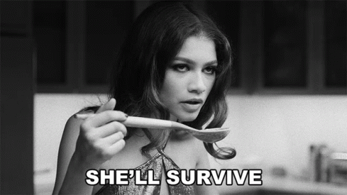 Black and White Woman Holding Spoon She'll Survive