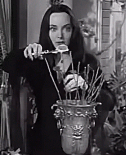 Black And White Woman Holding Vase GIF