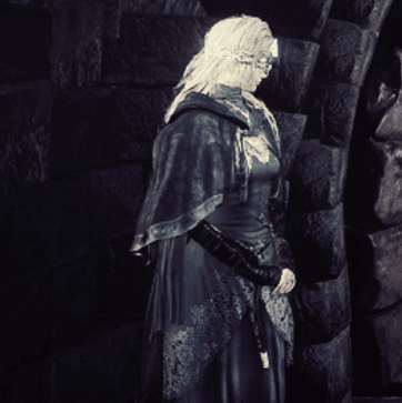 Black And White Woman In Front Of Brick Wall GIF