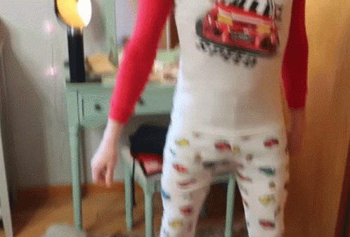 Black And White Woman In Patterned Shirt GIF