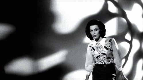 Black and White Woman in Patterned Shirt