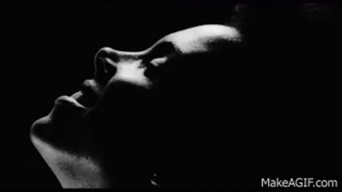 Black and White Woman Open Mouth Dark Room