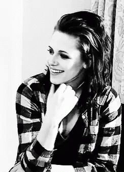 Black and White Woman Smiling in Plaid Shirt