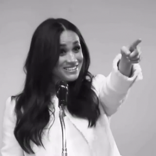 Black and White Woman Speaking into Microphone