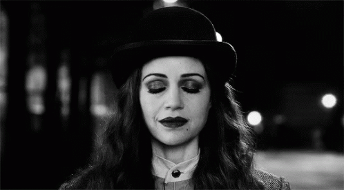 Black And White Woman With Bowler Hat And Glowing Eyes GIF