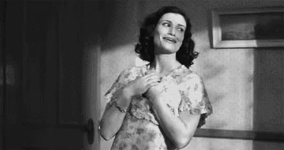 Black And White Woman With Hands On Chest GIF