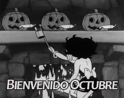 Black And White Woman With Pumpkins By Fireplace GIF