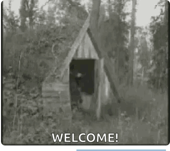 Black And White Wooden House In Woods Saying Welcome GIF