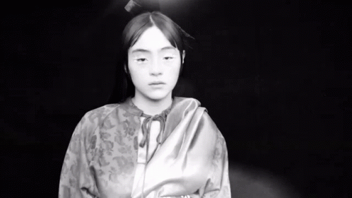 Black and White Young Girl in Kimono Looking at Camera