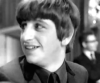 Black And White Young Man Smiling In Suit And Tie GIF