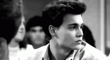 Black and White Young Man With Ponytail