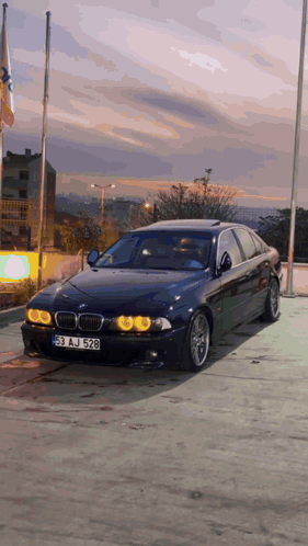 Black BMW With License Plate 53 AJ 528