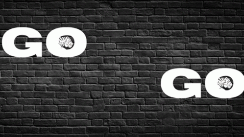 Black Brick Wall Saying Go Go