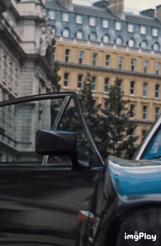 Black Car In Front Of Building With Imgplay GIF