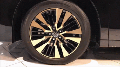 Black Car with Gold Rim and Toyota Logo
