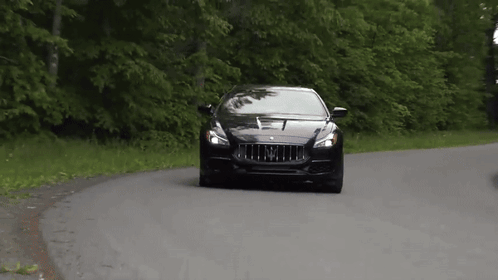 Black Car With Letter M Driving GIF
