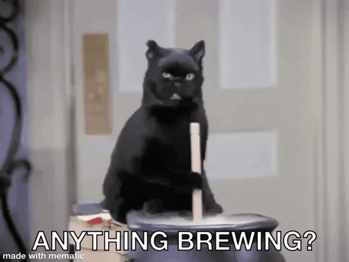Black Cat Sitting on Cauldron Brewing