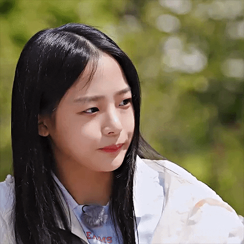 Black-Haired Girl in White Jacket Blue Dance Shirt