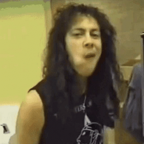 Black Haired Woman Making Funny Face Black Vest