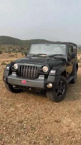 Black Mahindra Thar Jeep Parked on Dirt Field