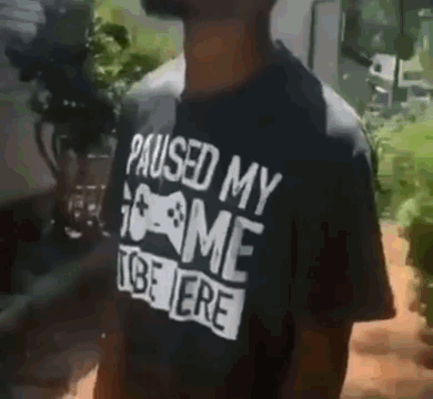 Black Man Donning A Pause Printed Tee GIF