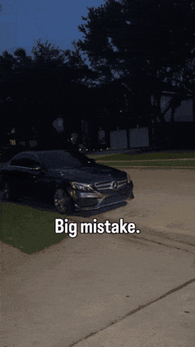 Black Mercedes Parked in Driveway Saying Big Mistake