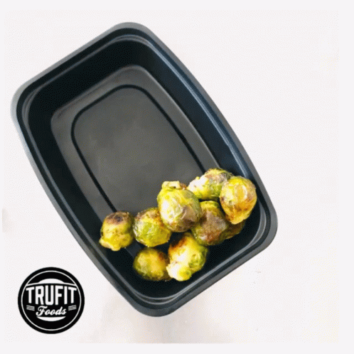Black Plastic Container of Brussels Sprouts With Trufit Foods Logo