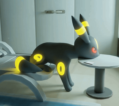 Black Rabbit With Yellow Circles Lying GIF