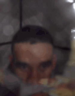 Black Shirt and Hat Man Talking Pay Per View Sign