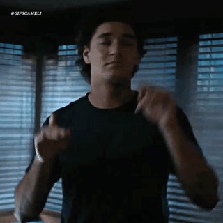 Black Shirt Man Dancing by Window Blinds