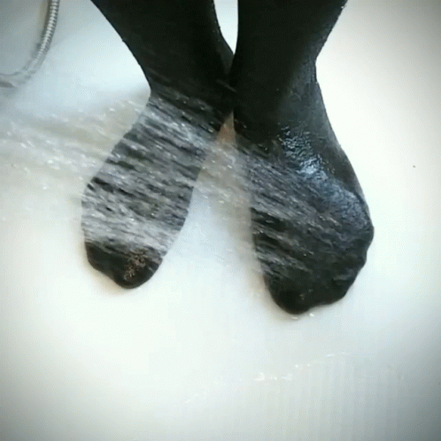 Black Socks Washed in Tub of Water