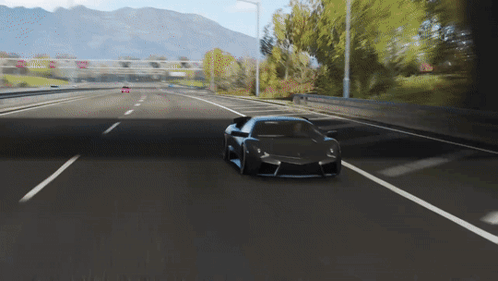 Black Sports Car Driving Down Highway With Mountains